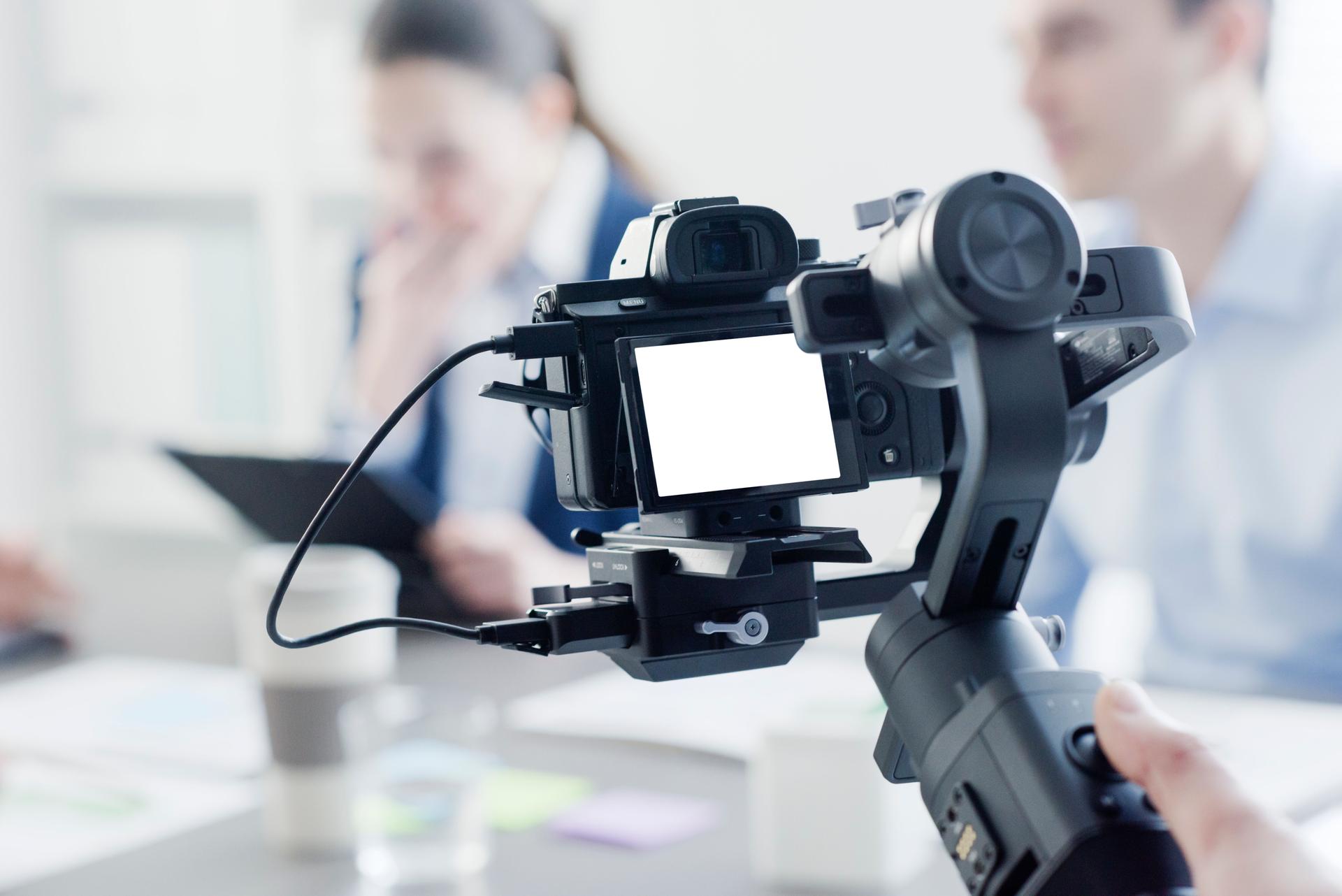 Professional videomaker shooting a video